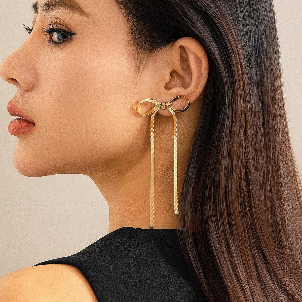 Elegant Long Bow Drop Earrings in Gold