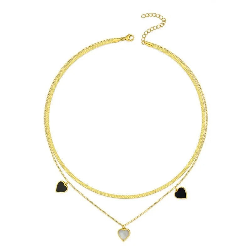 Dual-Layer Golden Necklace with Black and White Heart Pendants