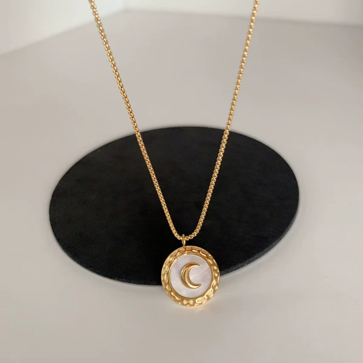 Golden Crescent Moon Pendant Necklace with Textured Frame