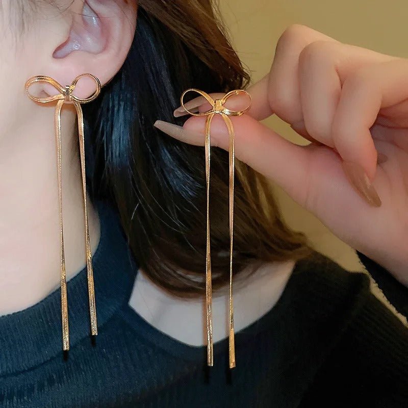 Elegant Long Bow Drop Earrings in Gold