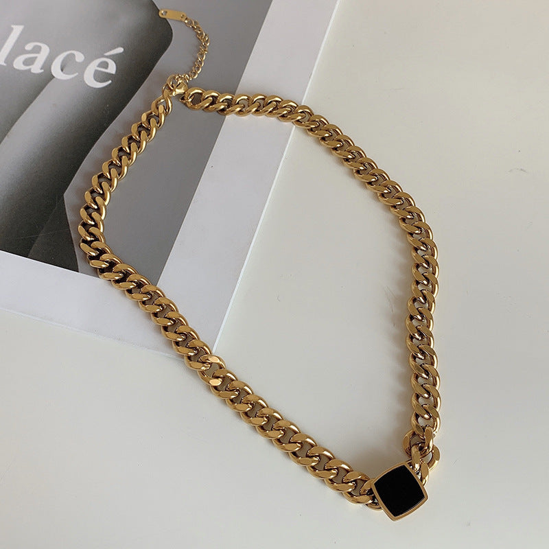 Bold Gold-Plated Cuban Link Chain Necklace with Black Accent Pendant