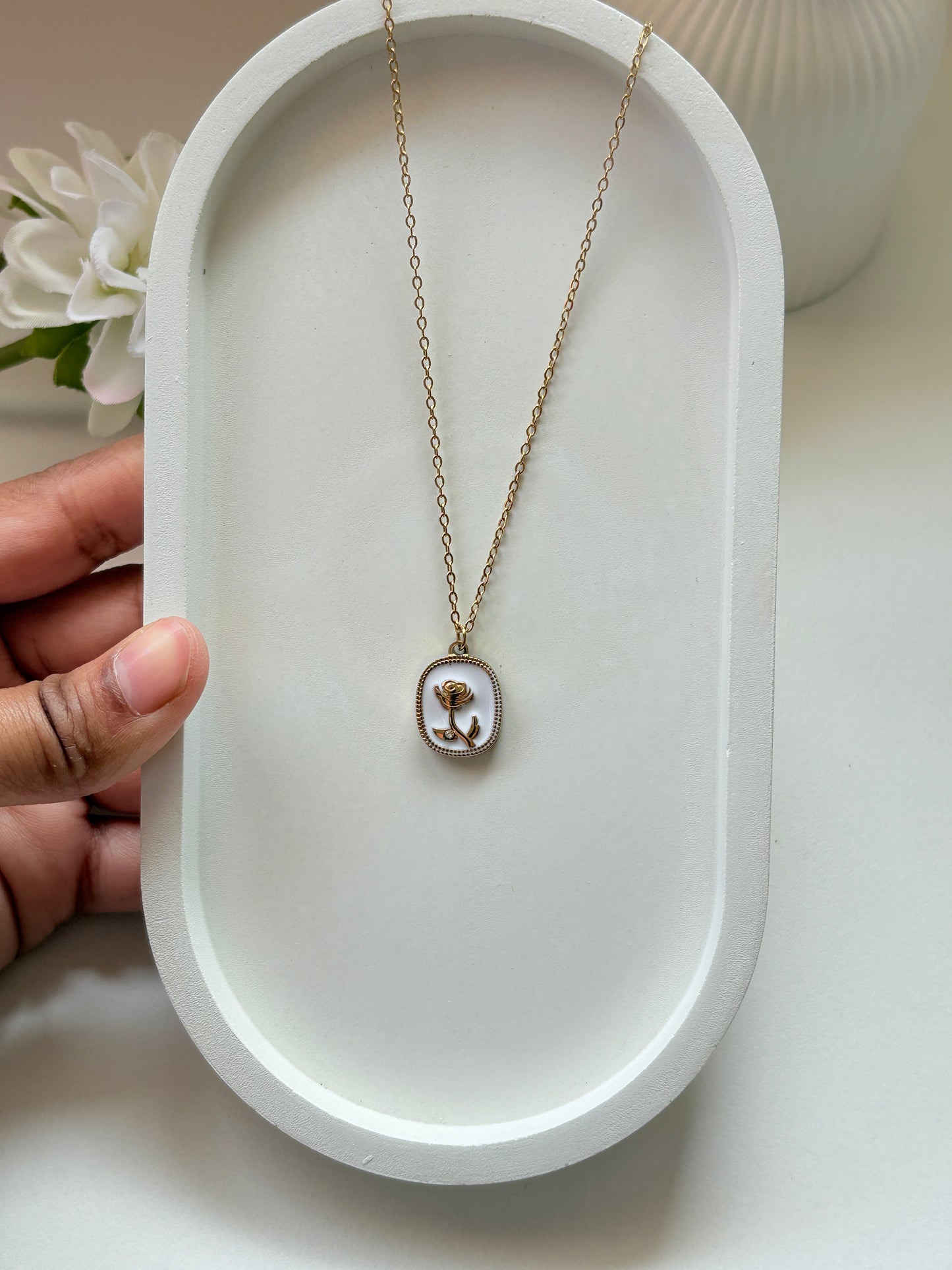 Elegant Golden Rose Pendant Necklace with White Enamel Base