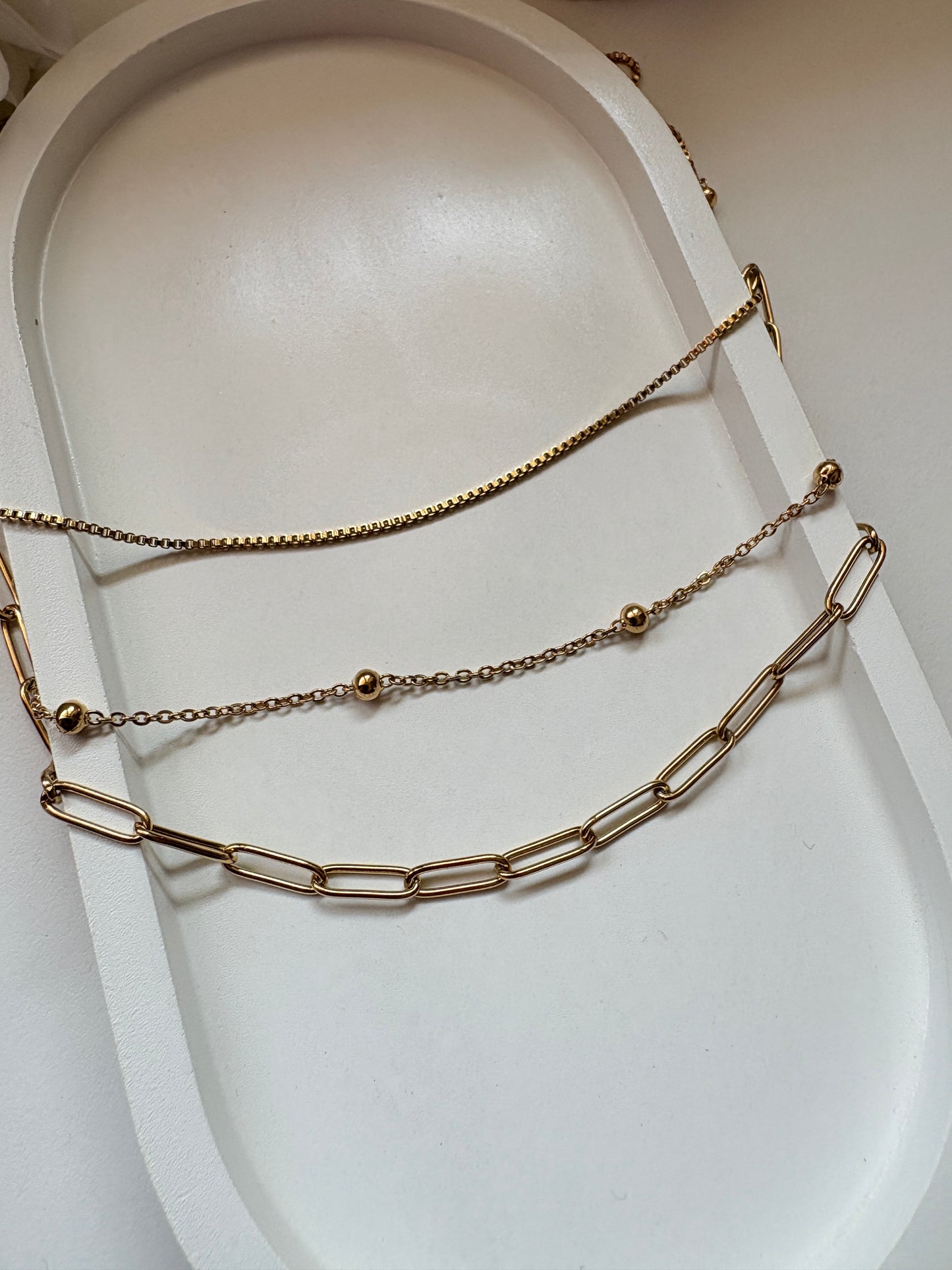 Multi-Layer Golden Chain Necklace with Textured Links and Bead Detailing