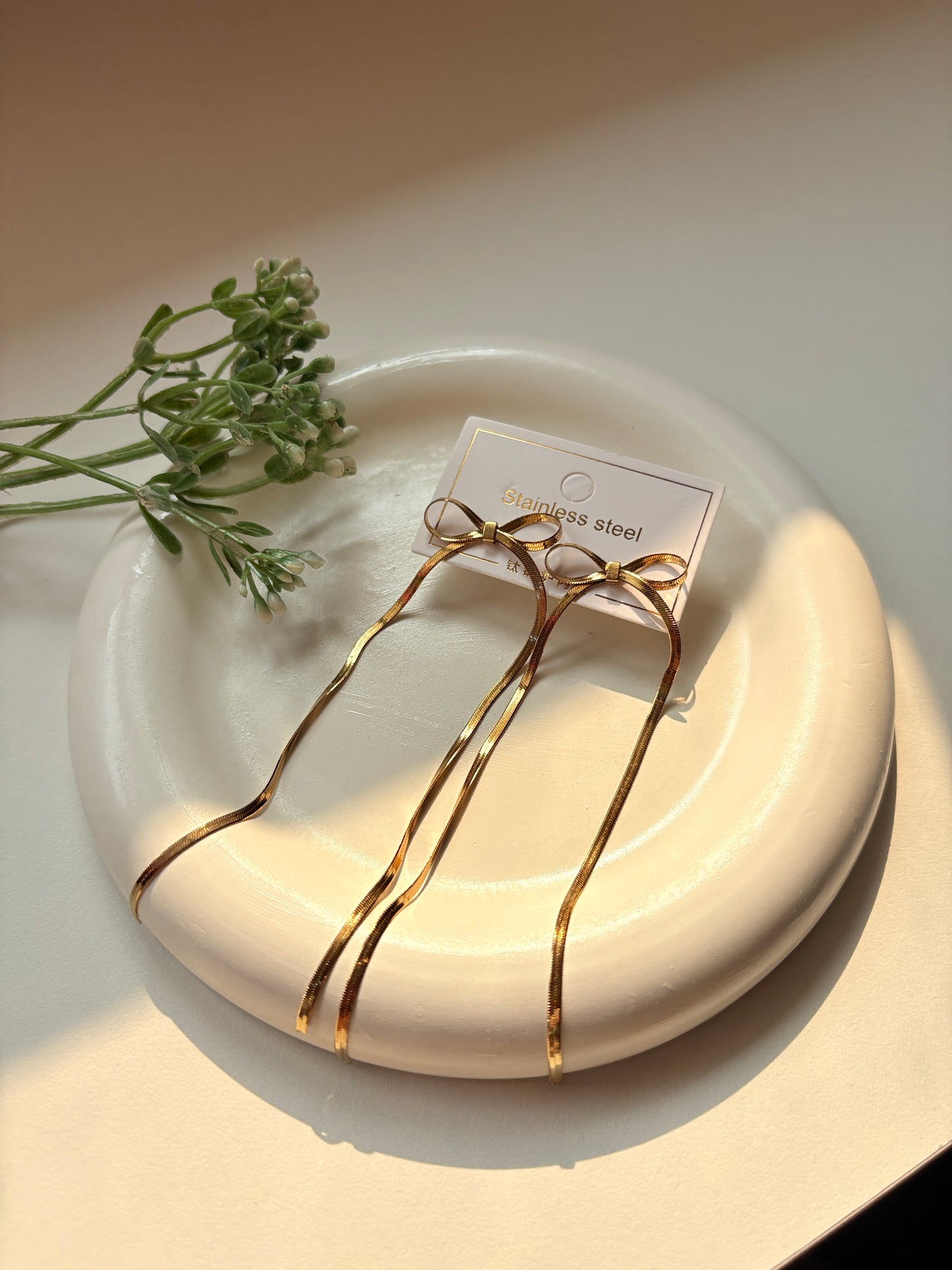 Elegant Long Bow Drop Earrings in Gold