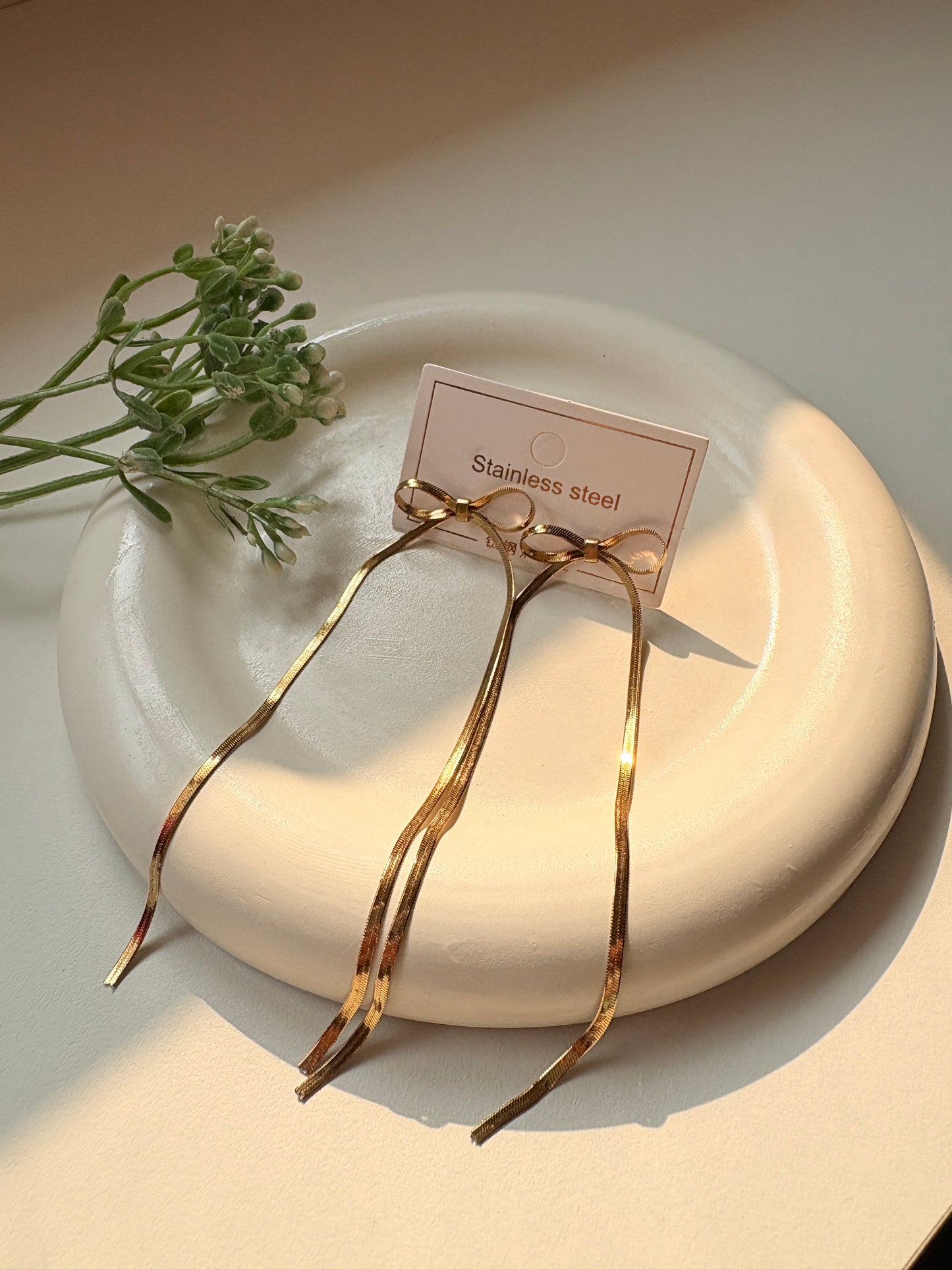 Elegant Long Bow Drop Earrings in Gold