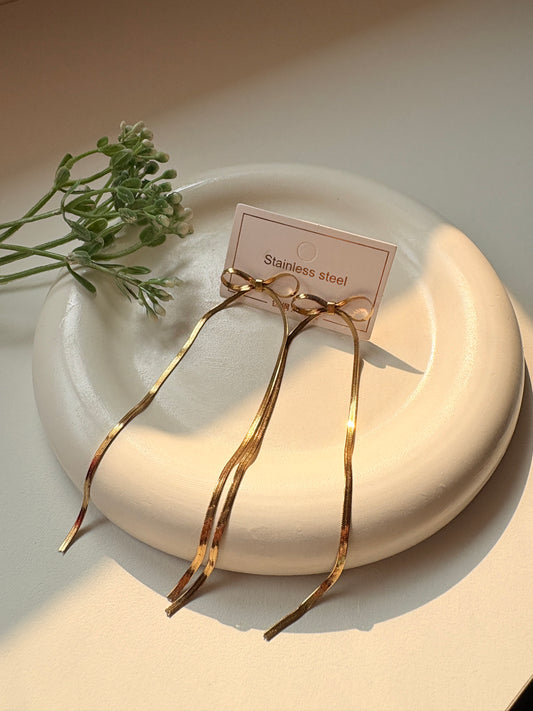 Elegant Long Bow Drop Earrings in Gold