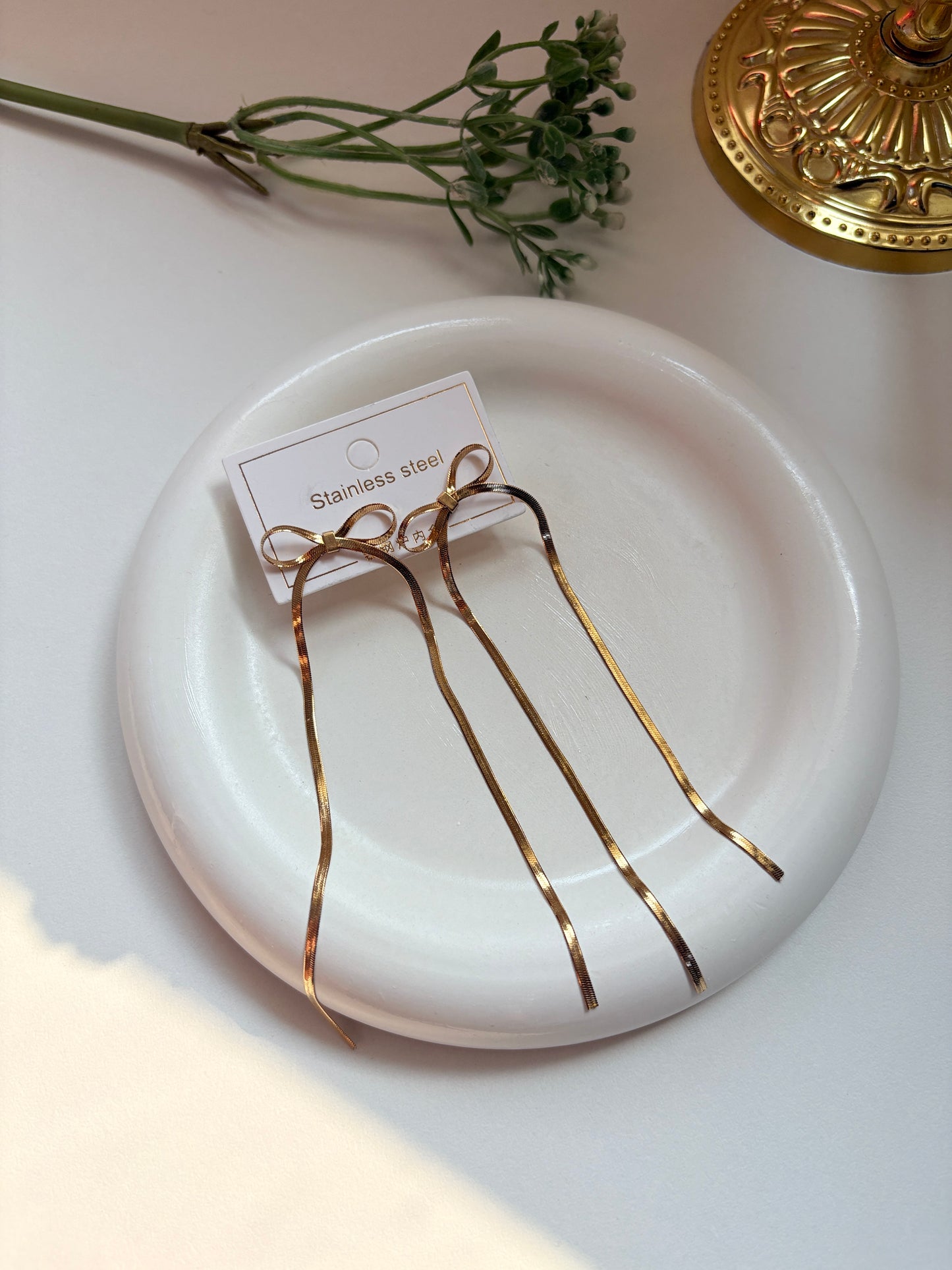 Elegant Long Bow Drop Earrings in Gold