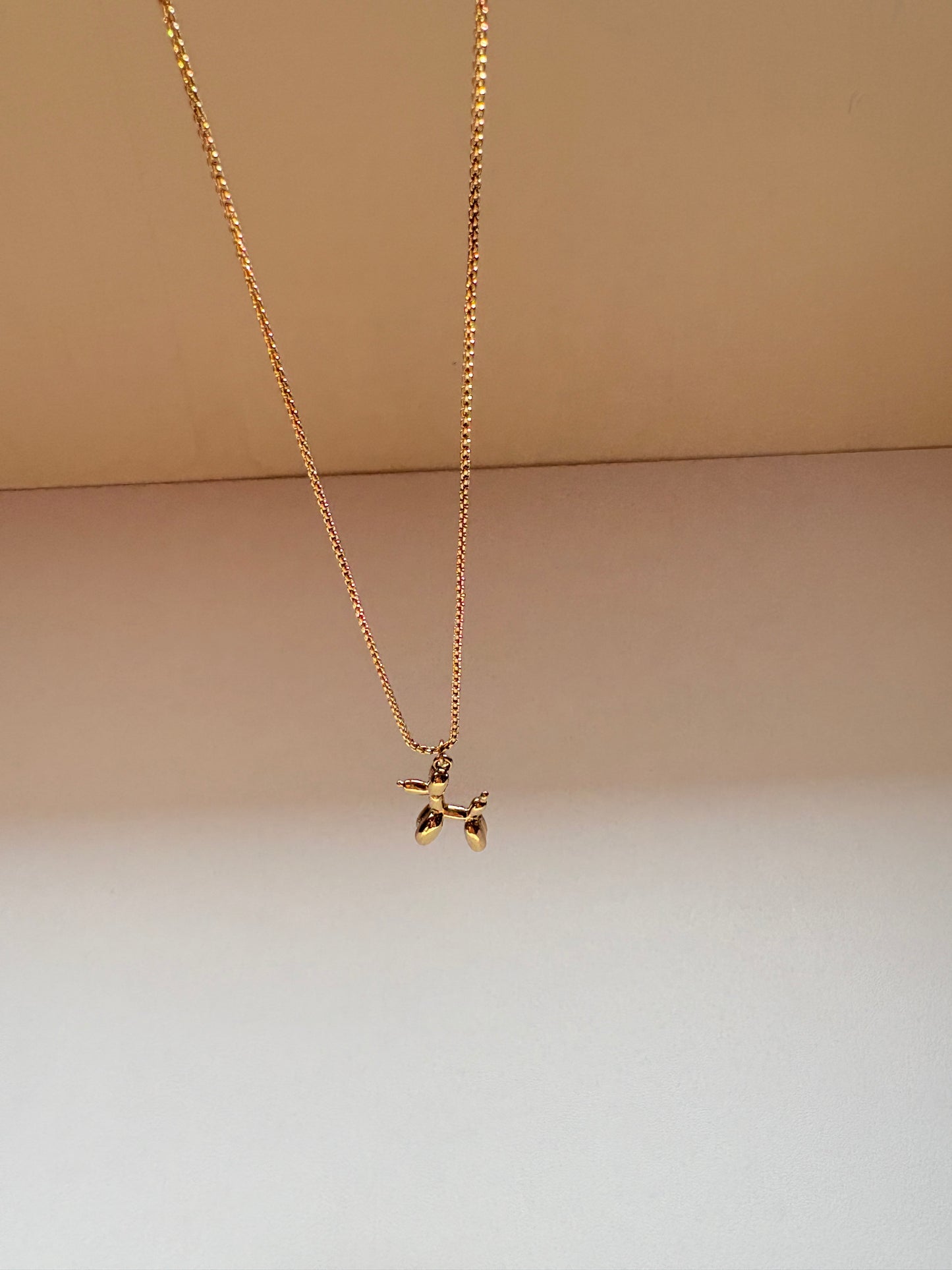 Gold Pleated Balloon Dog Pendant Necklace
